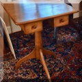 F20. Two-drawer tripod side table. 